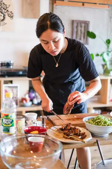 Chef plating in a home kitchen